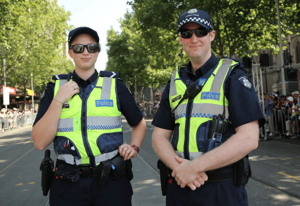 Smiling officers wearing Victoria Police uniforms Australia