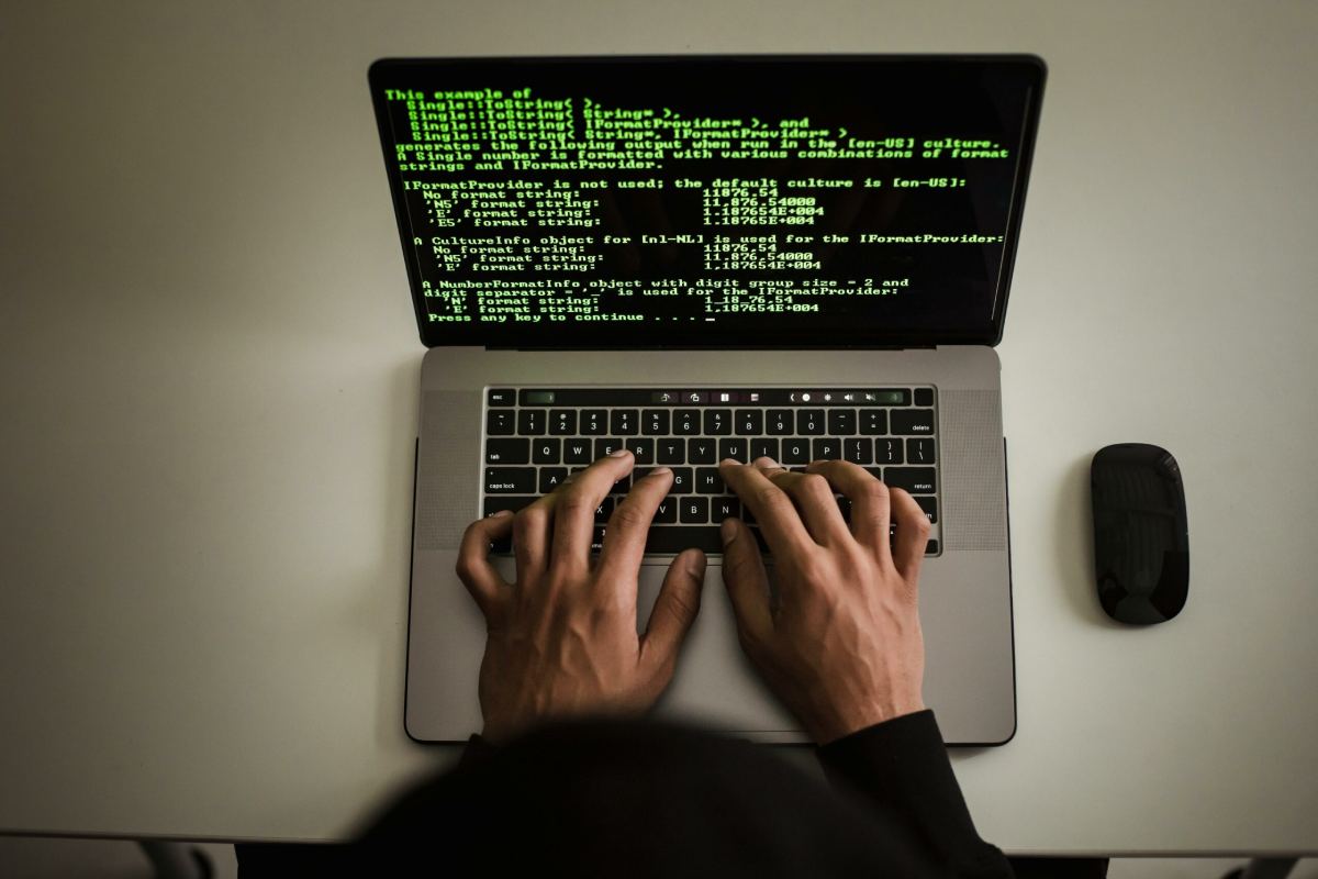 Programmer writing software on Australian laptop